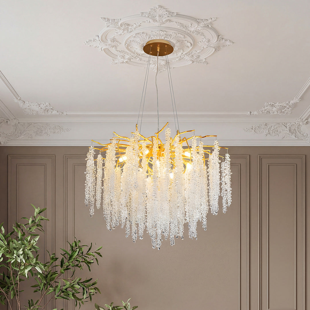 Beautiful modern gold crystal chandelier featuring gold branches and cascading clear crystals.