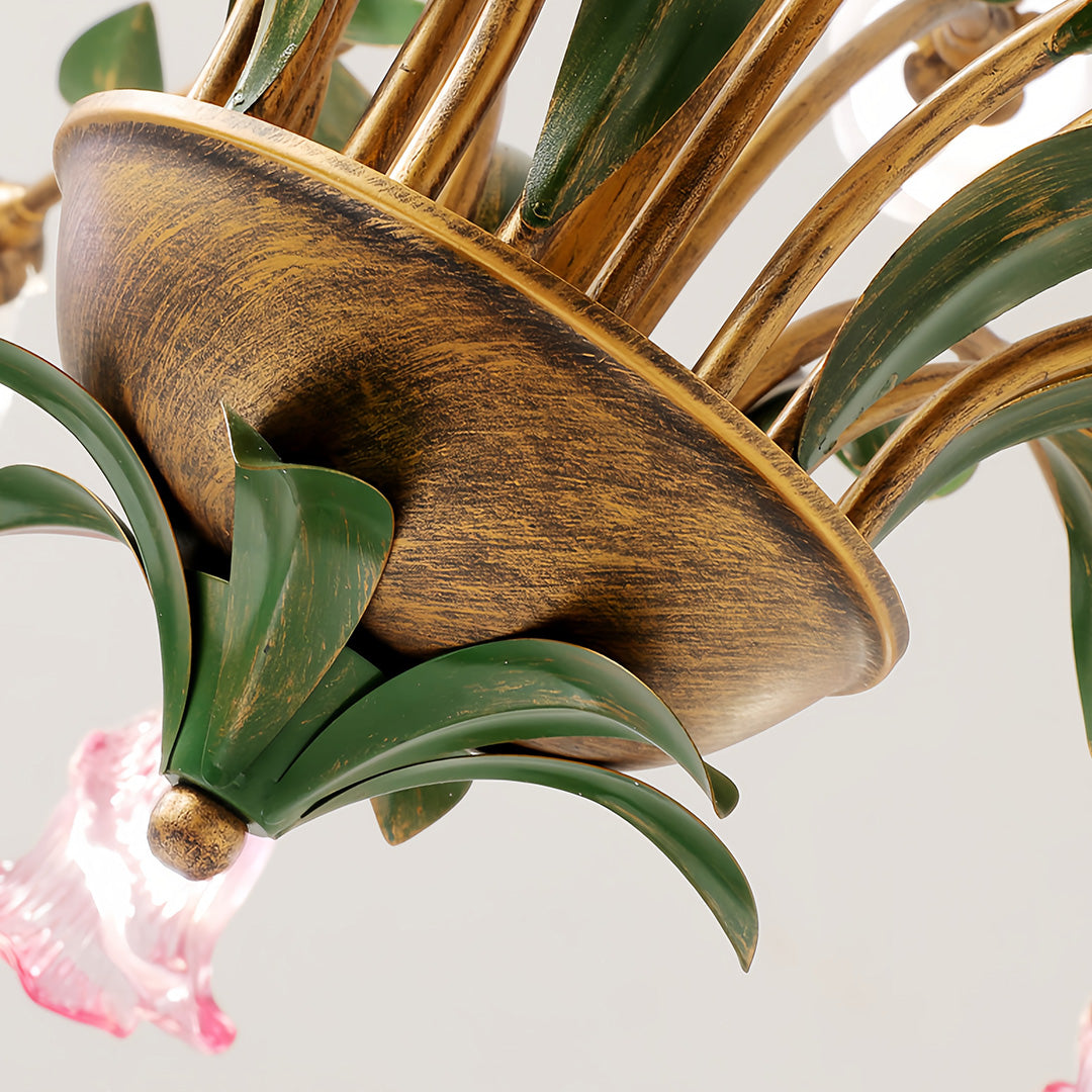 Vintage floral chandelier with white glass flowers in modern room with minimalist furniture and plants