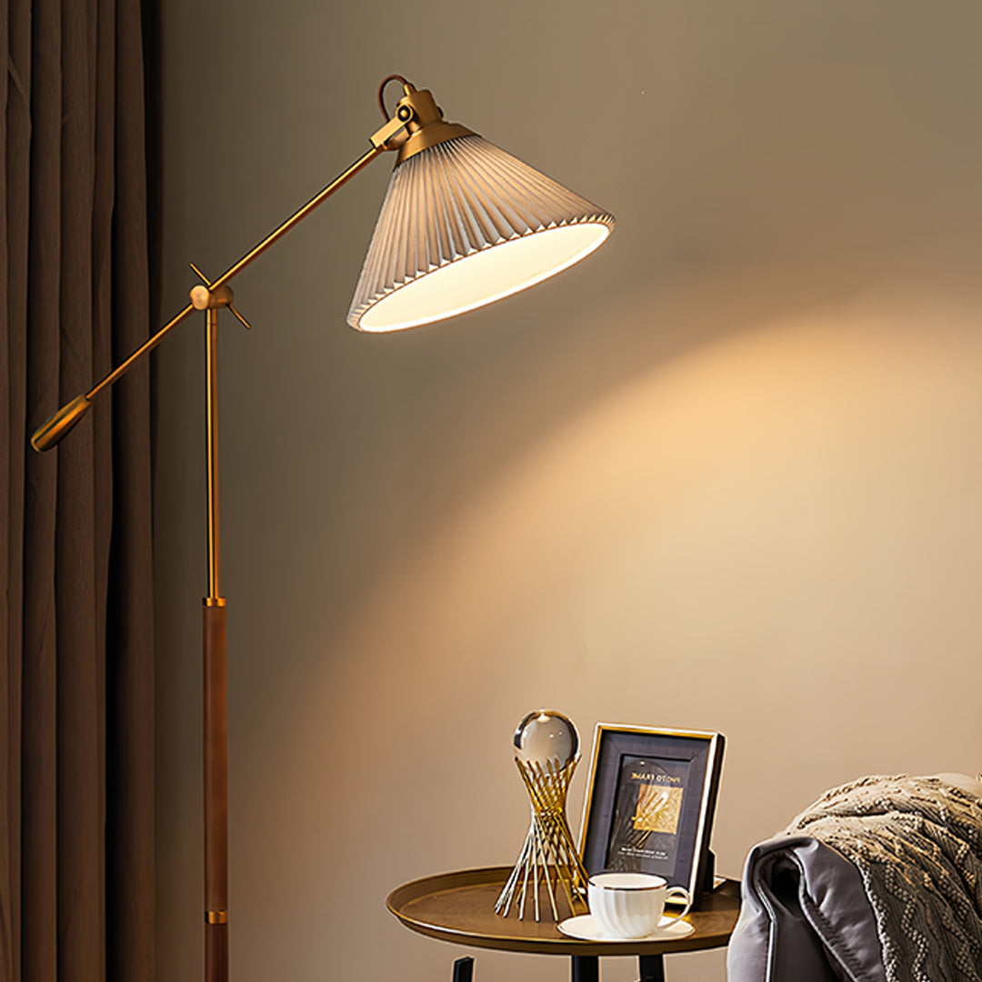 Cozy bedroom featuring small black pendant light providing focused task lighting beside comfortable chair