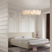 Luxurious bedroom featuring glass garland chandelier lights as centerpiece with sophisticated interior design elements