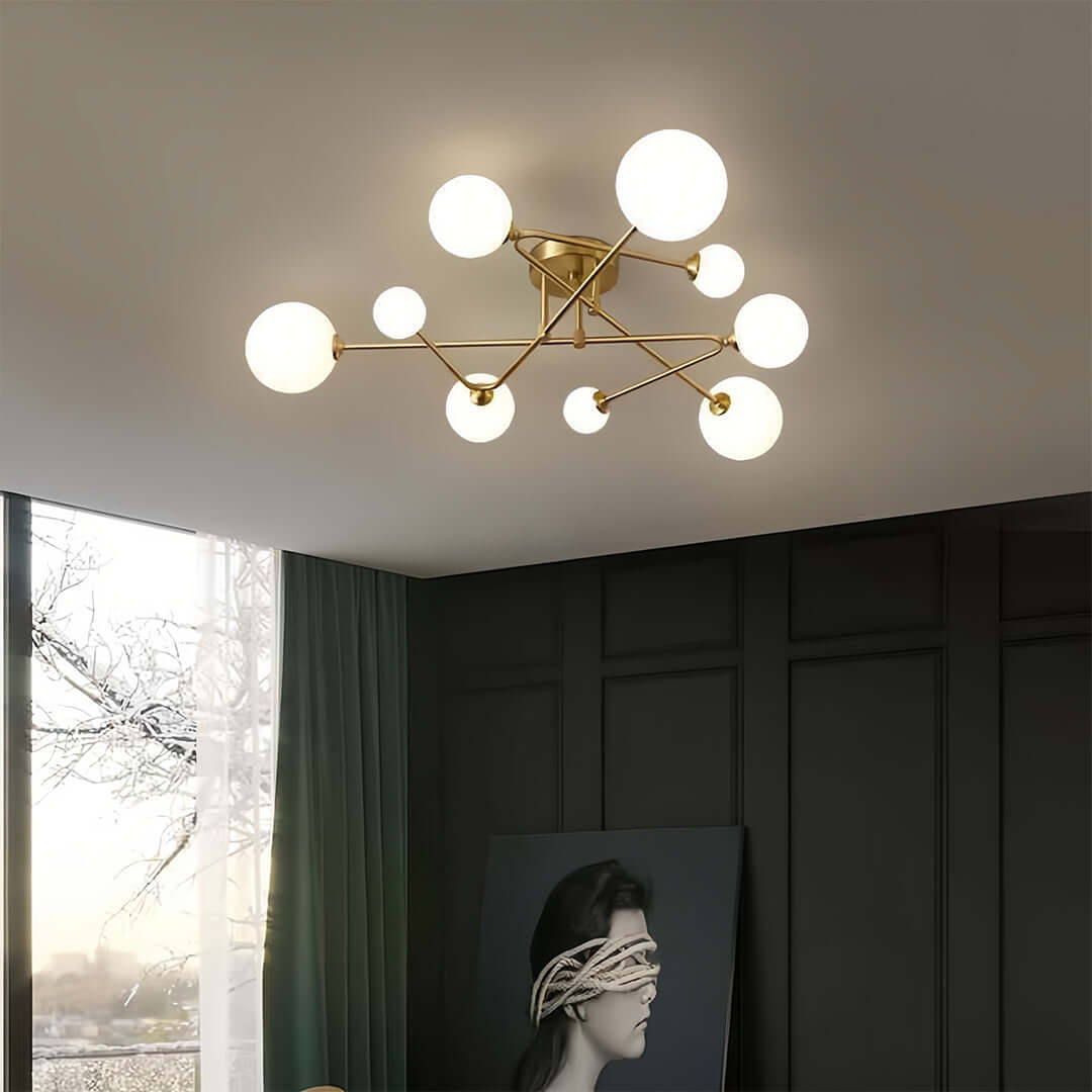 Modern bedroom featuring gold semi flush mount light with globe bulbs and architectural design