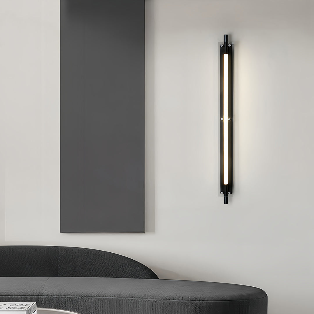 Slim black led wall strip lights installed beside a bed, providing soft accent lighting for a modern bedroom.