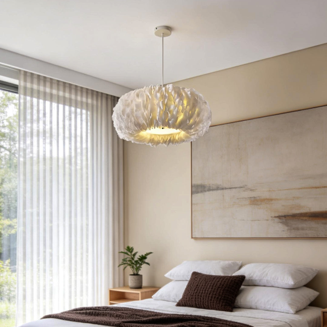 Minimalist bedroom featuring a warm toned fluffy hanging light above the bed for cozy illumination.