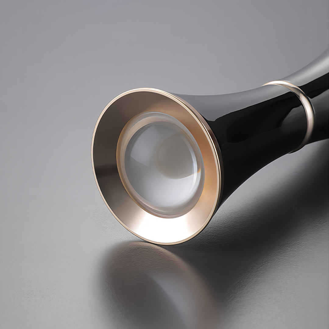 Small black pendant light positioned in stylish bedroom interior with wooden accents