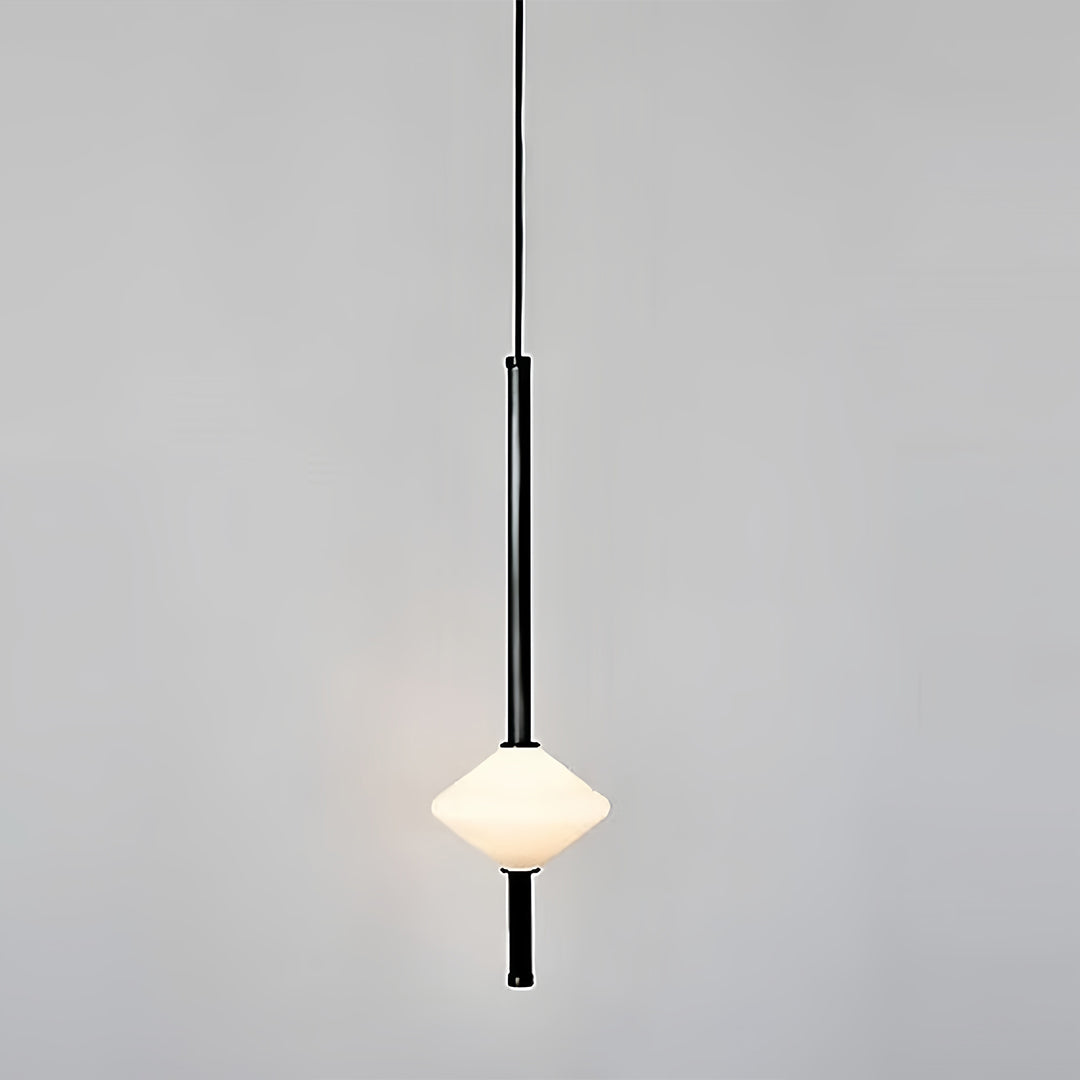 Scandinavian bedside pendant light with single white sphere and black rod in neutral setting