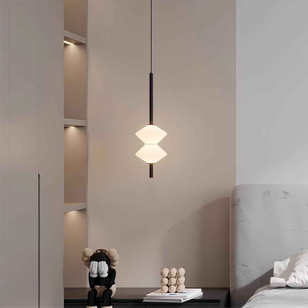 Stylish bedside pendant lights with layered white shades creating ambient lighting in modern bedroom
