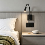 Modern bedside reading wall lights with flexible gooseneck spotlight and integrated USB charging ports.