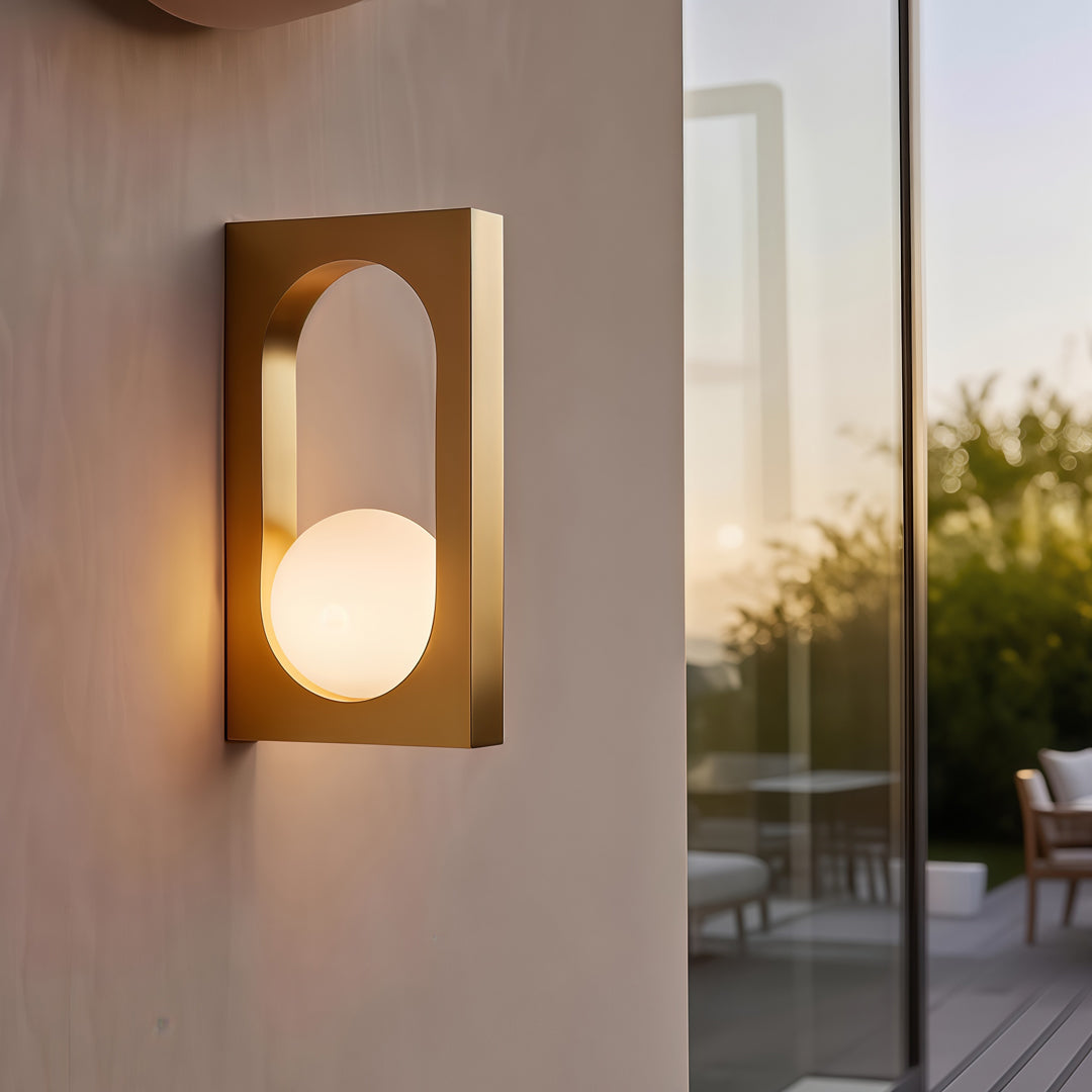 Warm beige fixture glowing softly against an exterior wall, showcasing modern led outdoor wall lighting ideas for cozy home entrances.