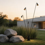 Bellflower lights with a modern design, illuminating an outdoor garden pathway at sunset.