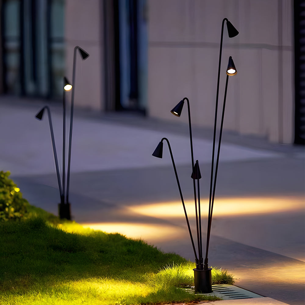 Bellflower lights with a sleek black design, enhancing a driveway with warm light.