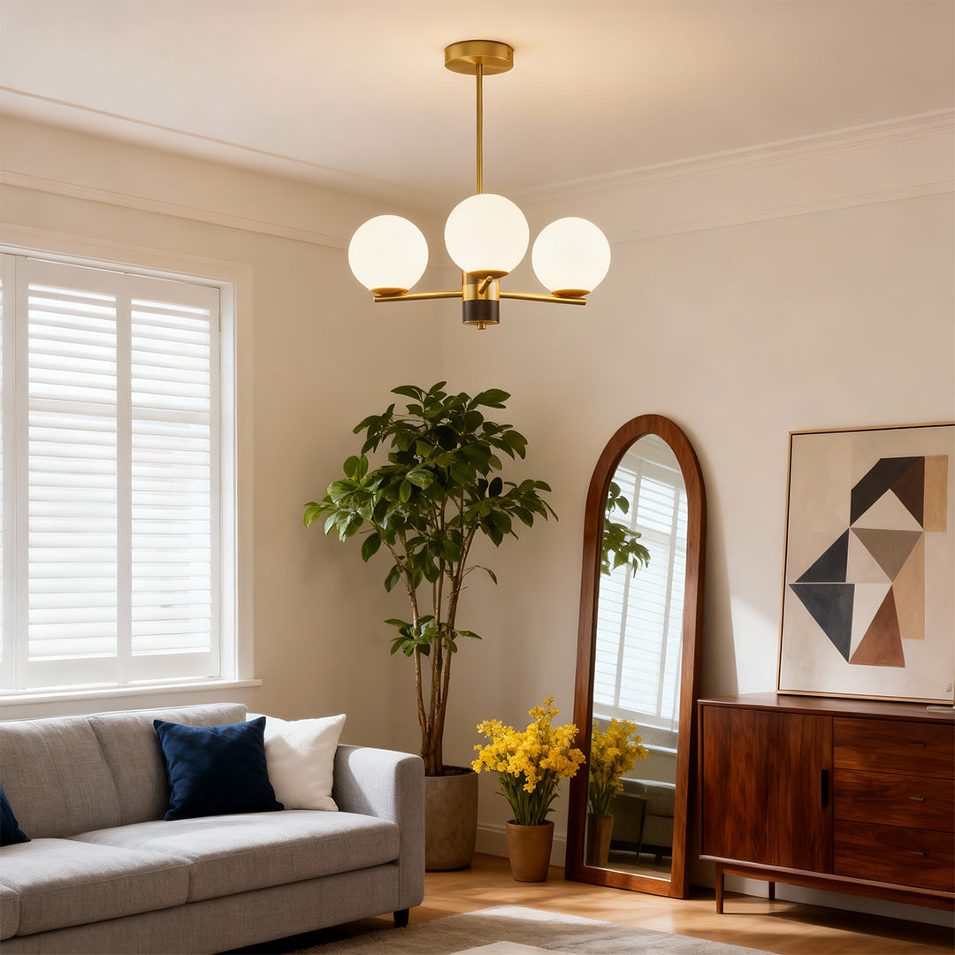 Best modern chandeliers enhancing elegant living space with brown leather sofa and greenery