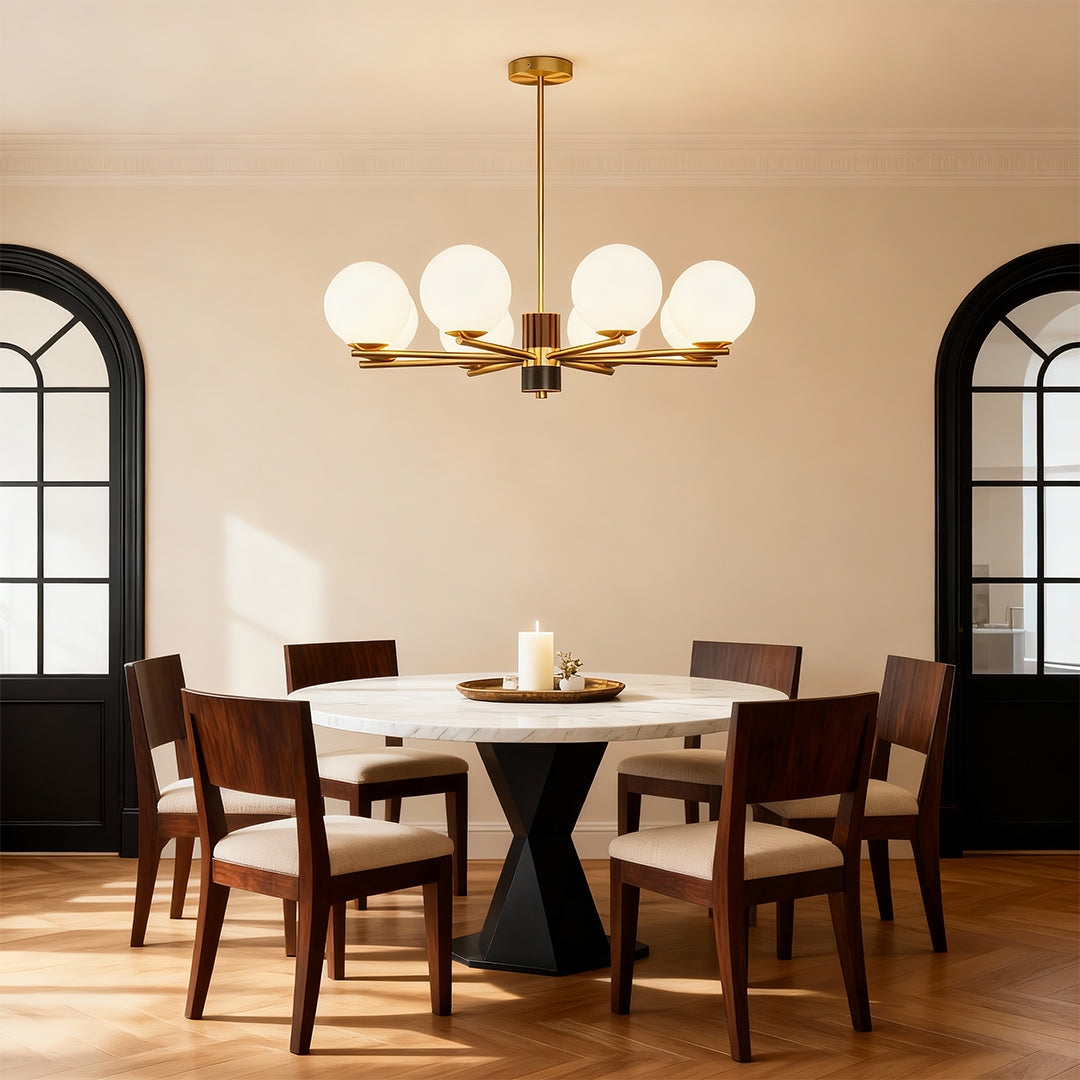 Modern luxury chandeliers illuminating warm dining room with arched windows and wooden furniture