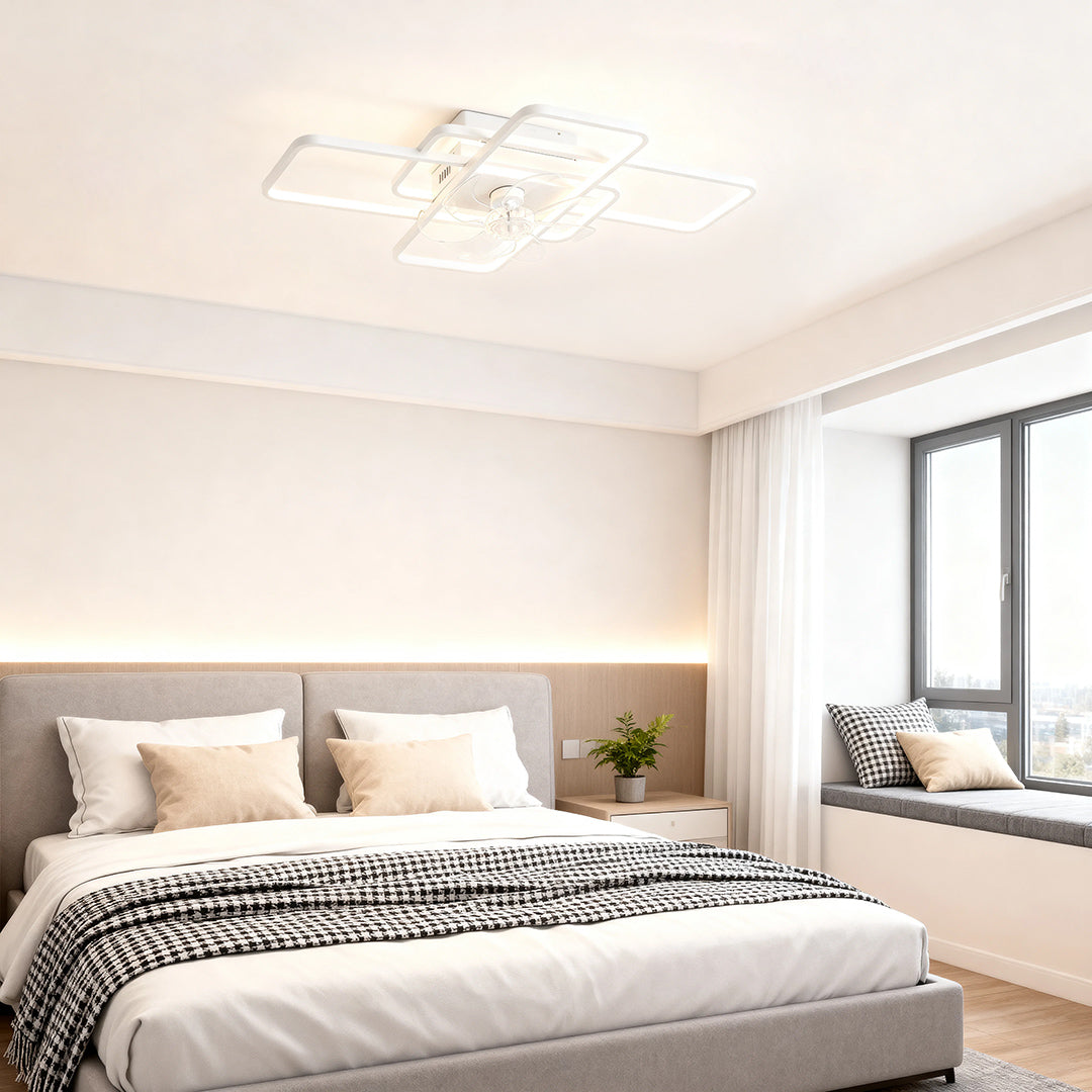 Big ceiling fans with lights creating ambient glow in serene bedroom with pink accent pillows