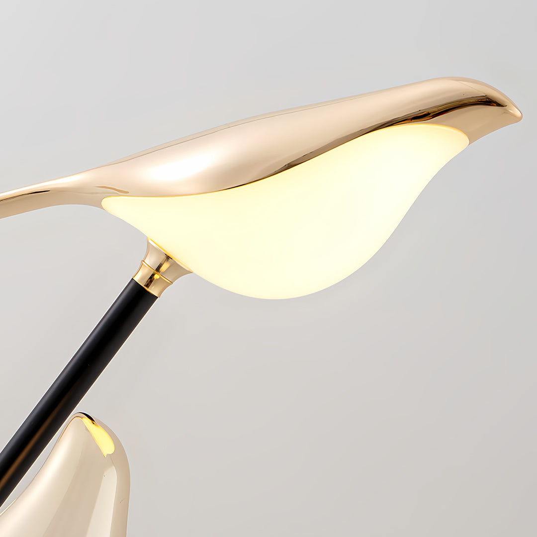 Bird floor lamp detail showing gold bird-shaped shade with black stem and premium construction quality craftsmanship