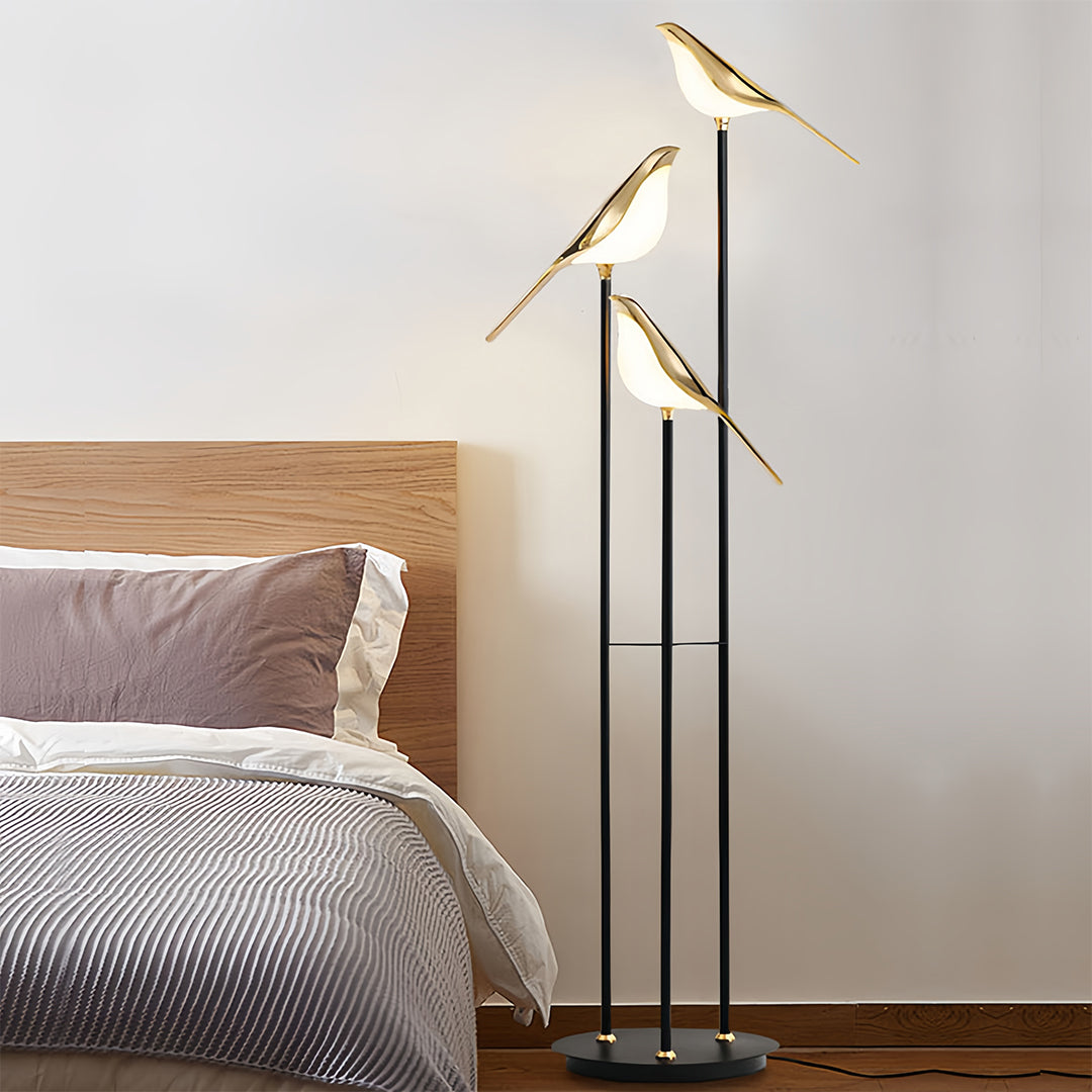 Bird floor lamp in minimalist bedroom with natural wood accents creating cozy ambient lighting atmosphere
