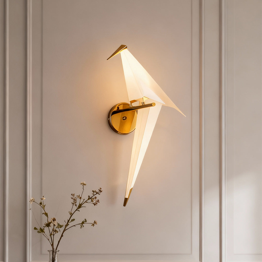 Bird wall light providing warm light in a contemporary hallway with white walls.