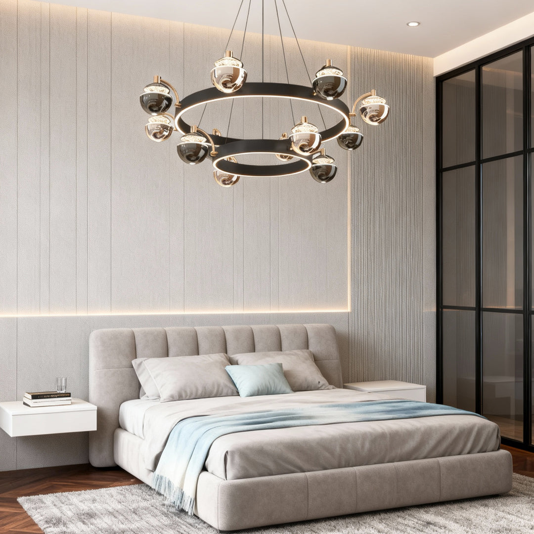 Black and gold modern chandelier providing ambient lighting in contemporary bedroom with textured wall panels and tufted bed