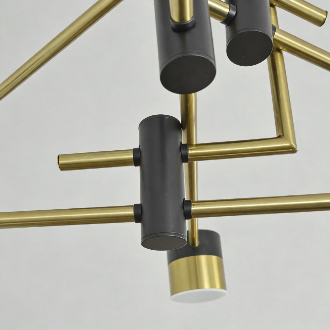Close up of black and gold sputnik ceiling light arms showing black and gold metal structure and cylindrical shades.