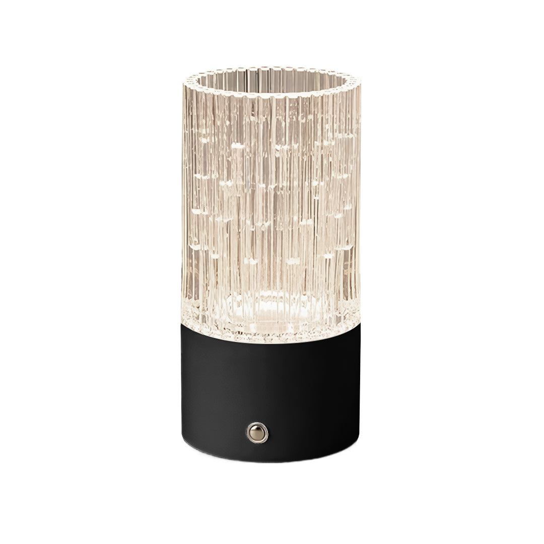 Black base deco table lamp providing a stark contrast to the sparkling acrylic crystal effect cylinder.