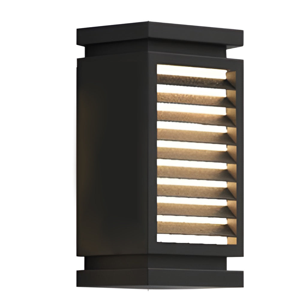 Black bollard light with detailed view of its angular top design.