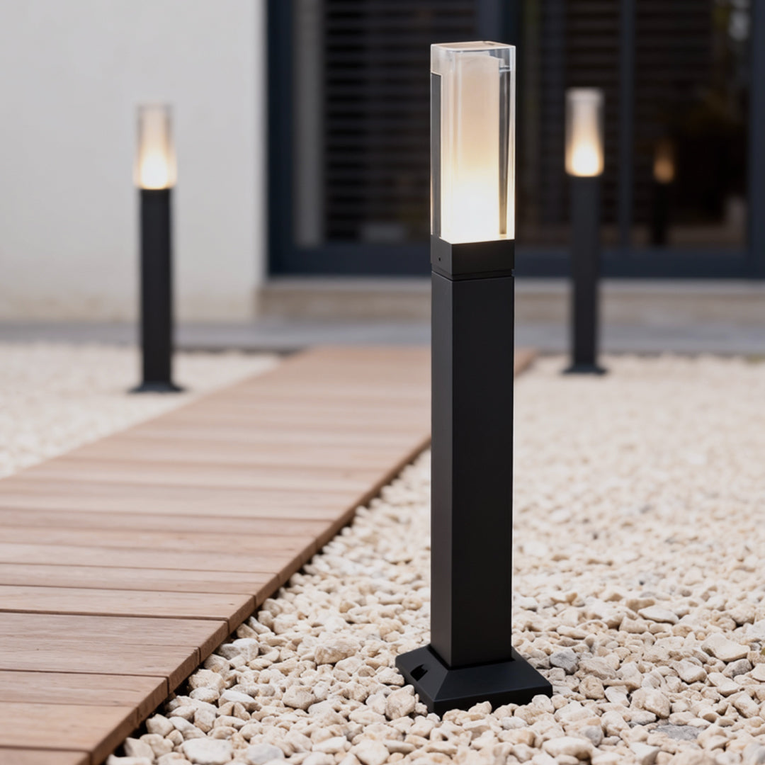 Pair of black bollard lights used for garden pathway lighting