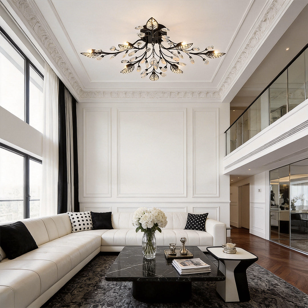 Black branch chandelier modern ceiling light displayed in a large double-height living room with elegant wall molding.