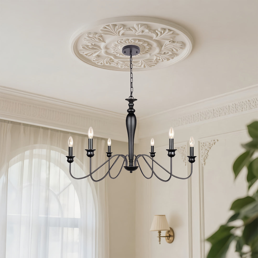 Black candle chandelier with decorative ceiling medallion creating refined atmosphere in neutral dining space