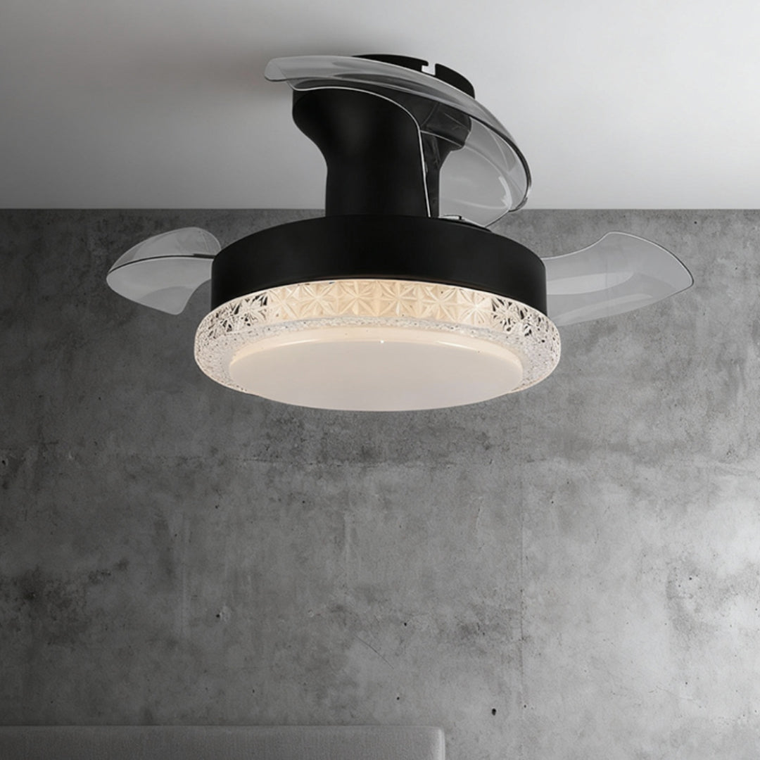 Black ceiling fan with light featuring three foldable transparent blades in retracted position on grey concrete ceiling.