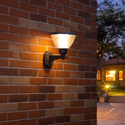 Warm LED wall light illuminating textured brick surface creating dramatic architectural lighting effects