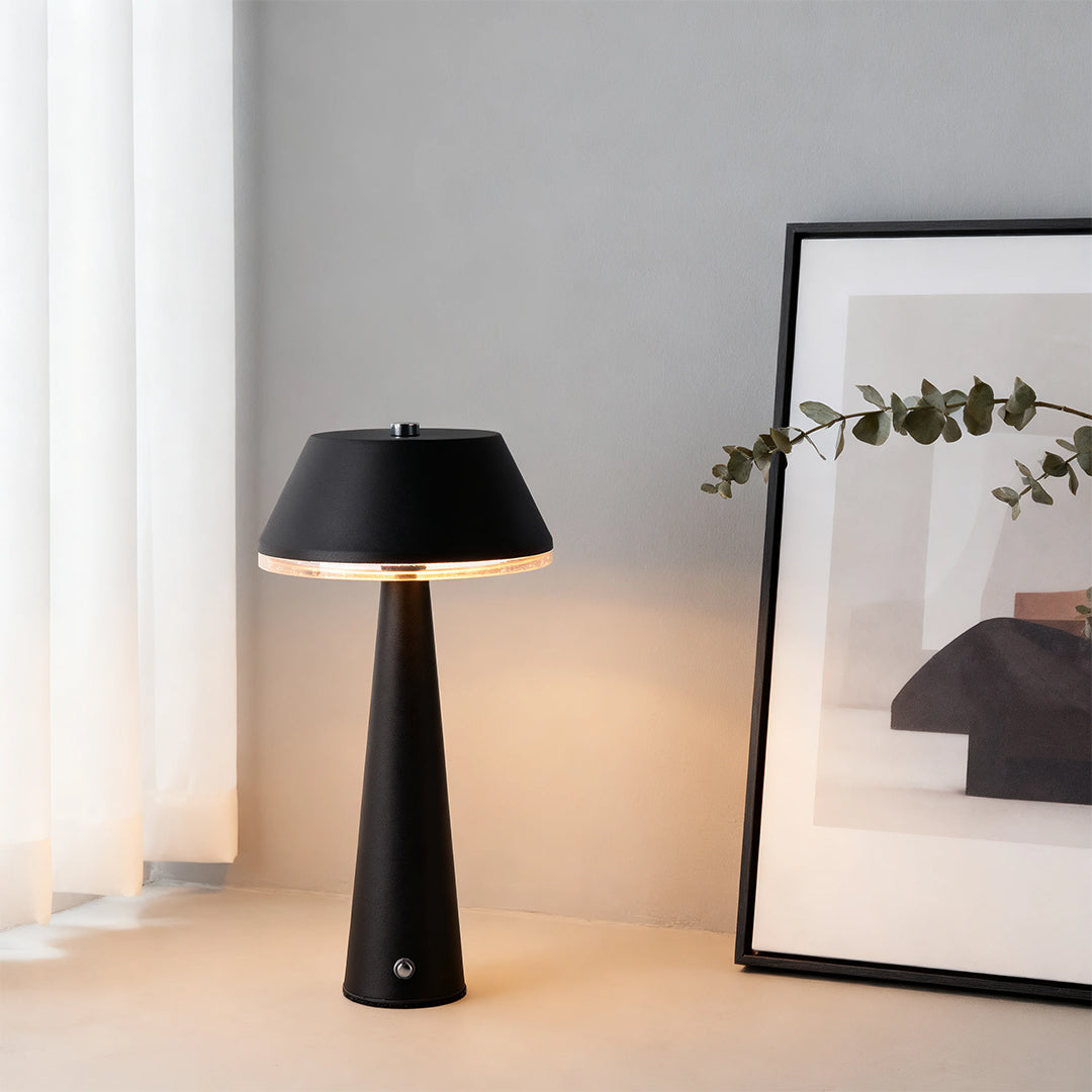 Black cone-shaped rechargeable table lamps with a large brim shade serving as stylish desktop lighting. 