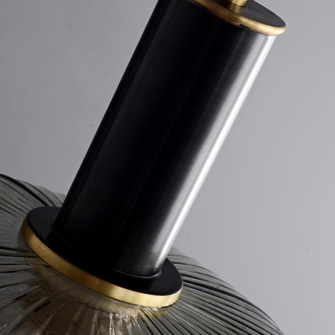 Close up of the black cylindrical holder and brass ring on a vintage glass pendant light ok ok