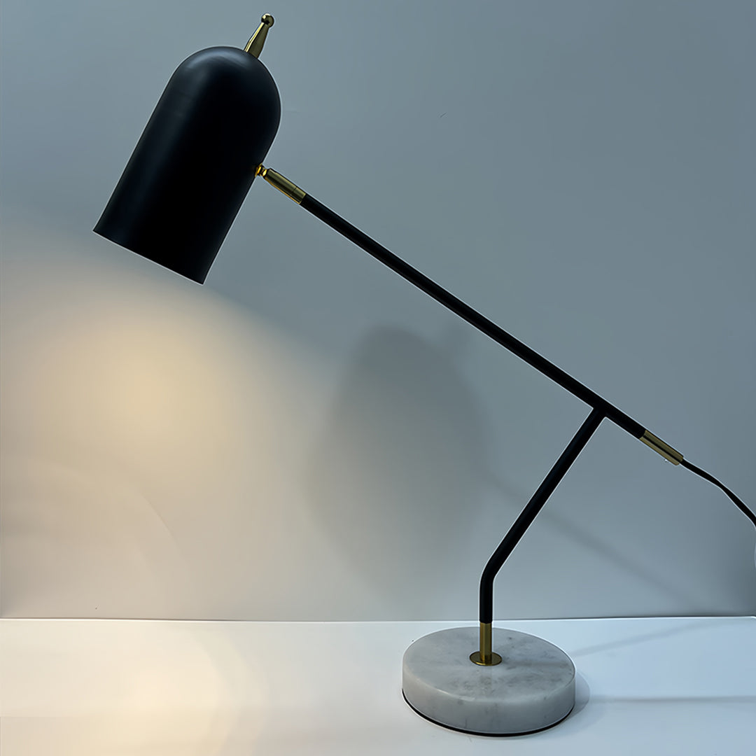 Black desk lamps illuminating work surface with adjustable positioning and focused beam