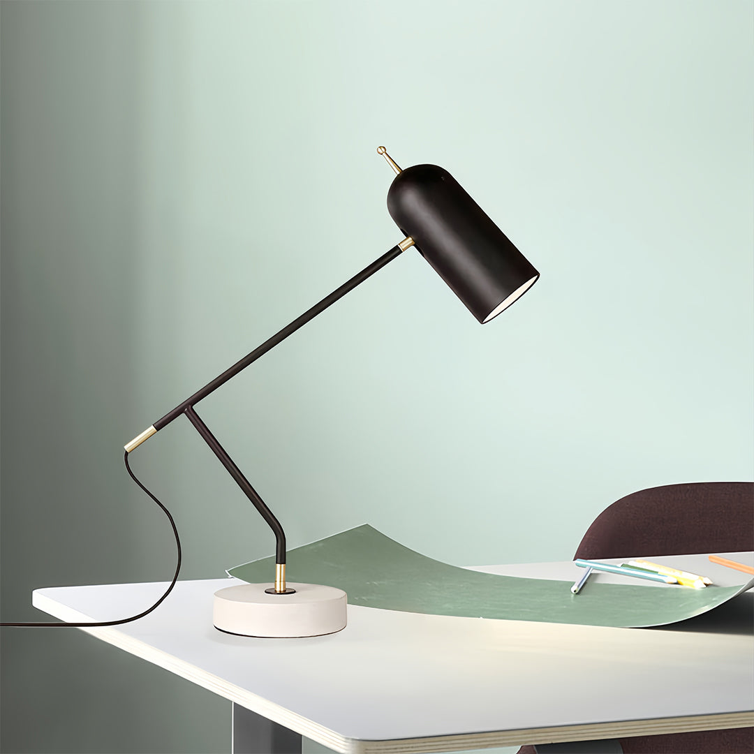 Black desk lamps positioned for reading with adjustable head angled over workspace