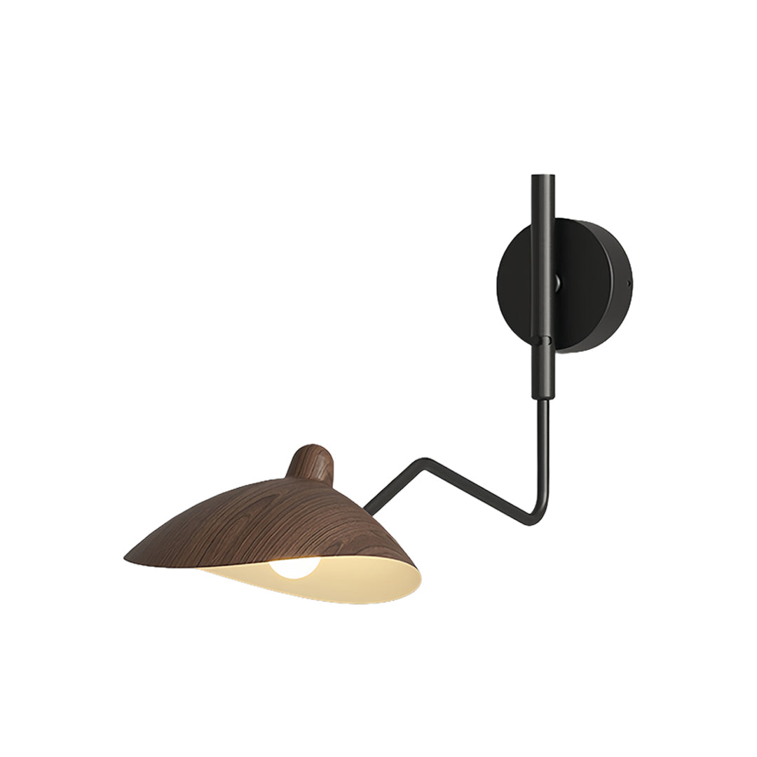 Black double swing arm wall light with two adjustable heads, providing task lighting over a home workspace near a wood desk.