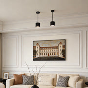 Black drum pendant light illuminating a modern living room with warm ambient glow.