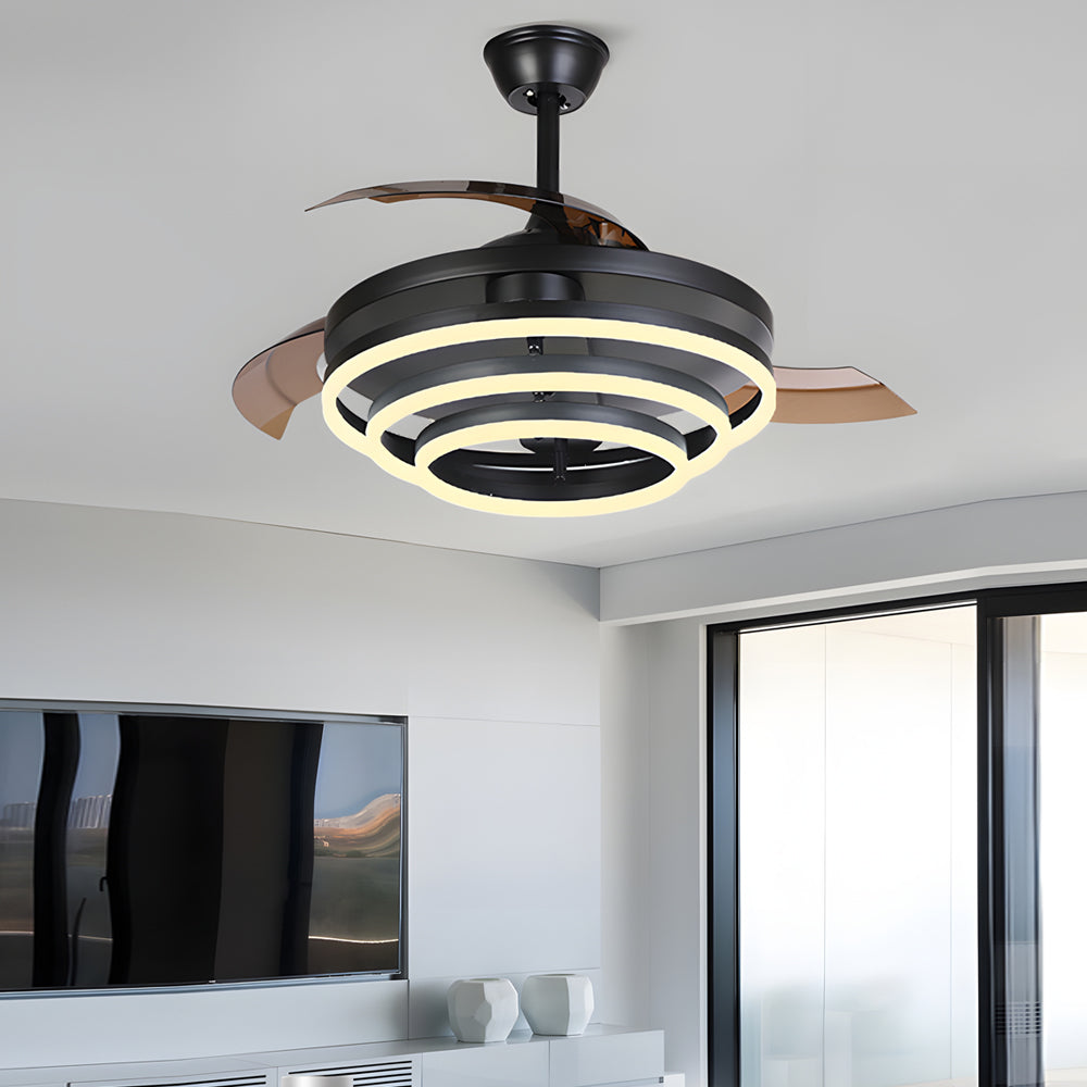 Black fan with light with a close-up of its circular light and fan blades.