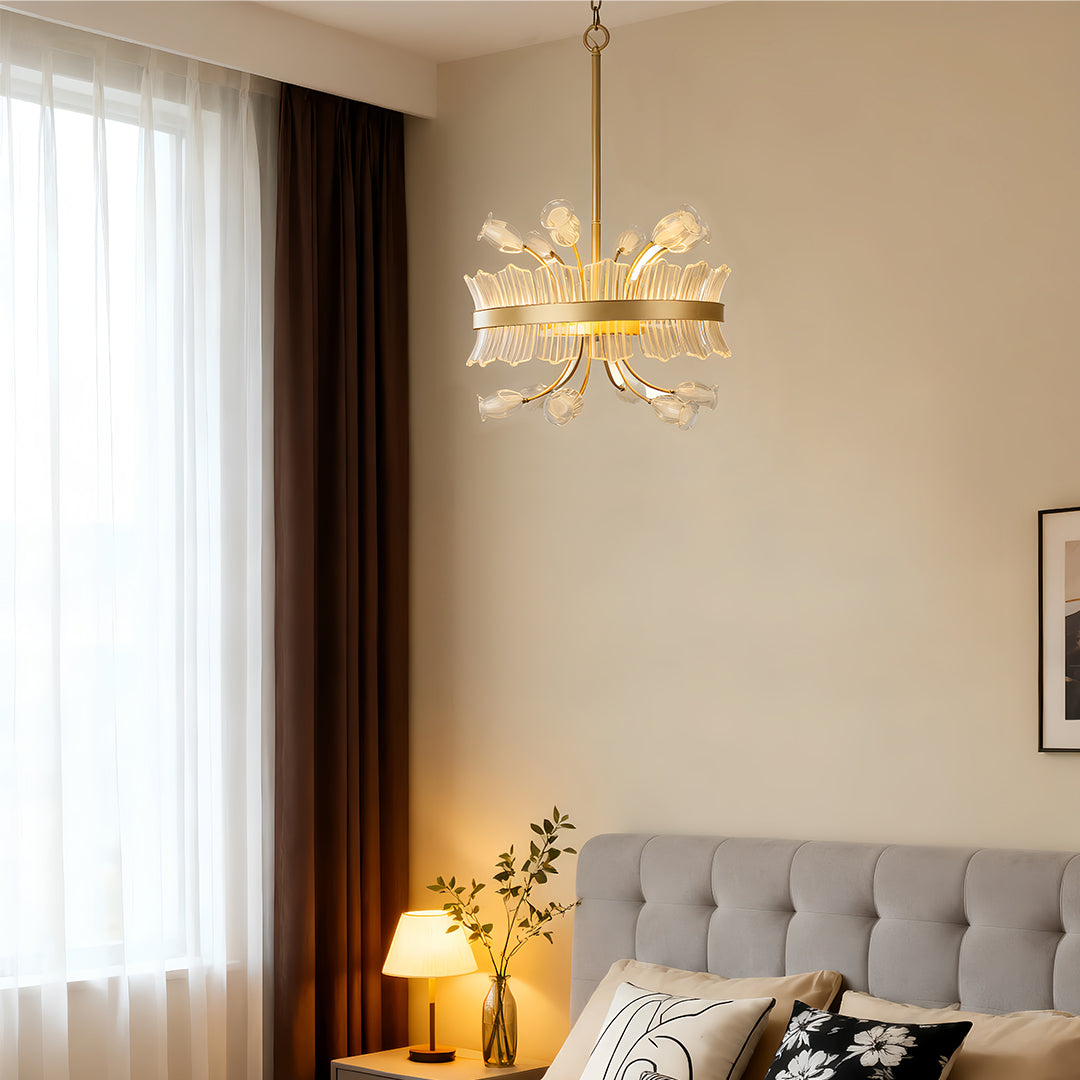 Elegant gold blossom chandelier with crystal accents in a sophisticated bedroom