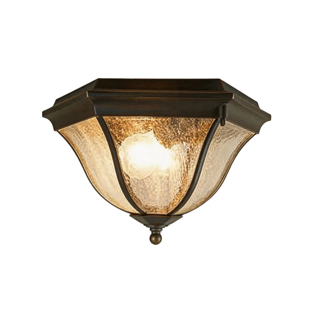 Black flush mount light fixture with an antique-style frame, seeded glass shade, and two exposed bulbs.