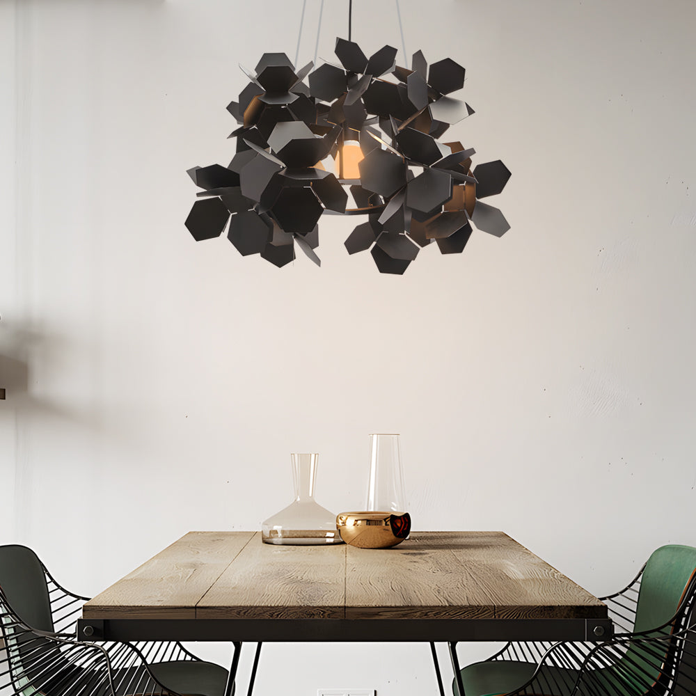 Black geometric chandelier with a leaf design, providing elegant lighting in a contemporary space.