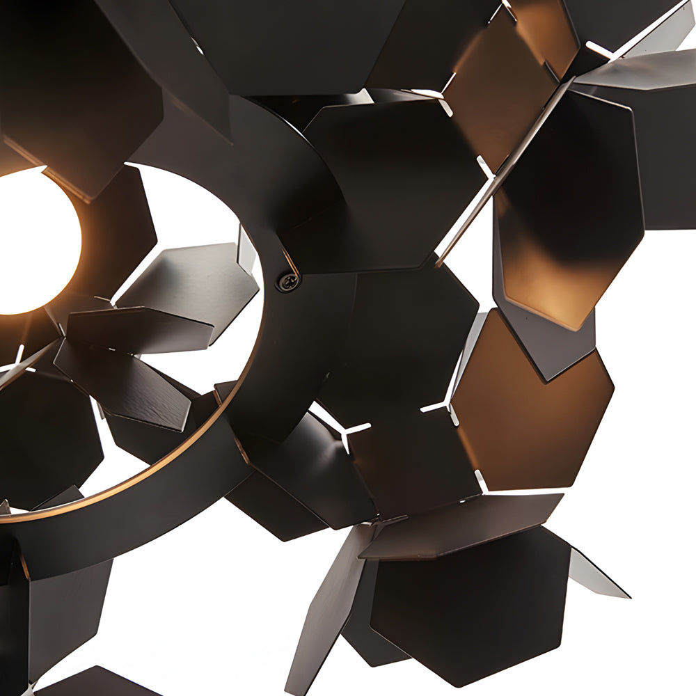 Black geometric chandelier with a leaf design, providing elegant lighting in a contemporary space.