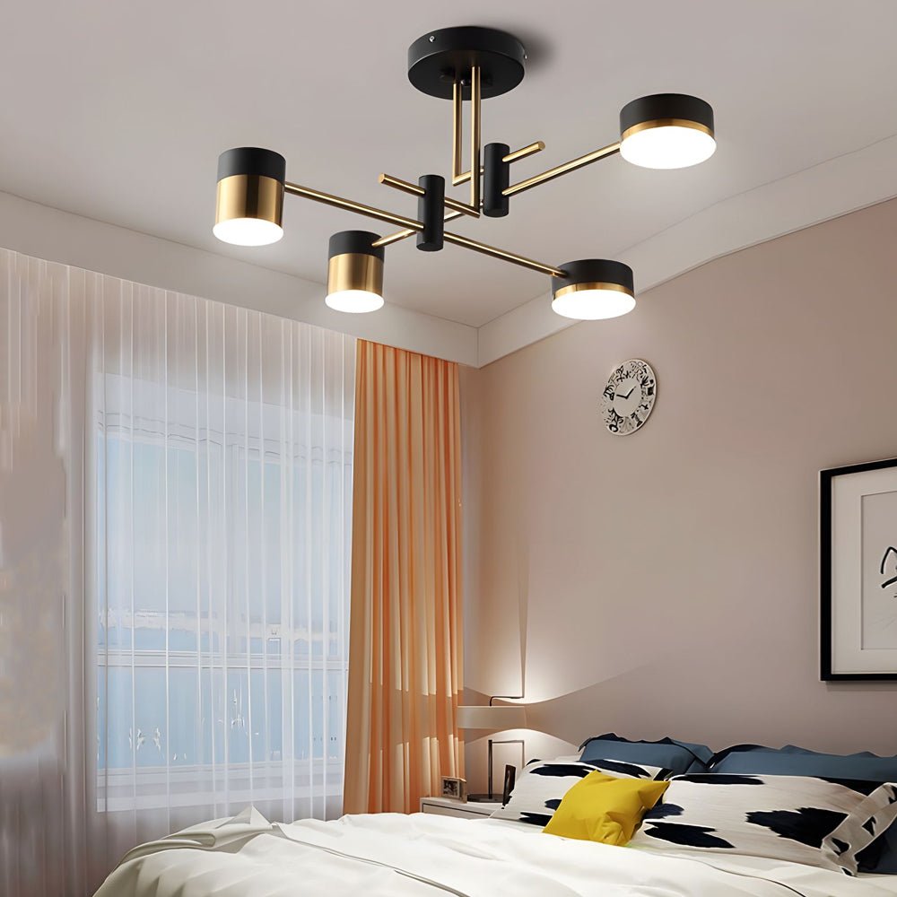 Black and gold sputnik ceiling light adding elegance to a contemporary bedroom with soft lighting.