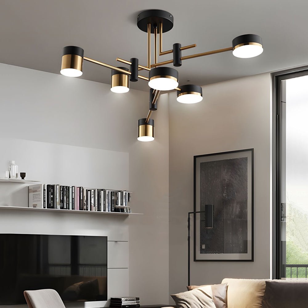 Black and gold sputnik ceiling light providing warm illumination in a modern dining area.