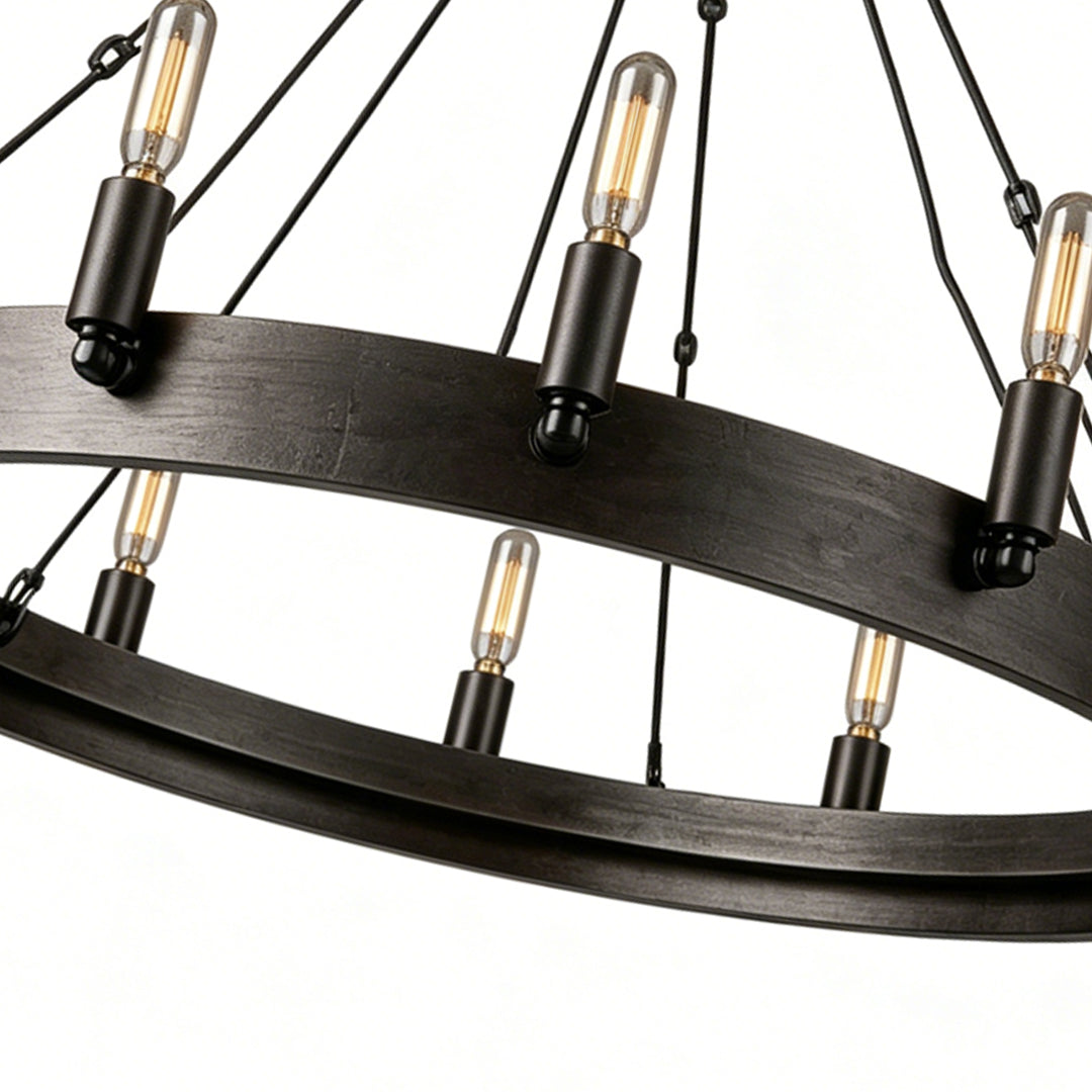 Black iron chandelier detail featuring layered circular iron frame and vintage-style Edison bulbs.