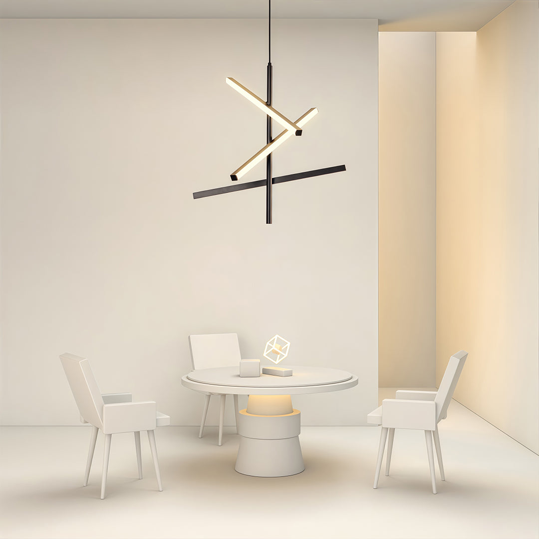 Black iron linear chandelier creating focal point above white dining set in bright neutral room.