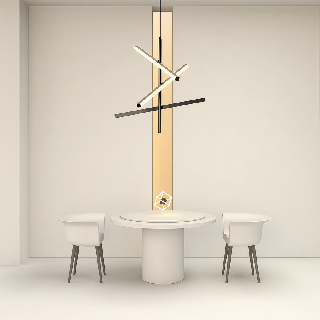 Black iron linear chandelier illuminating all-white dining space with round table and modern chairs.