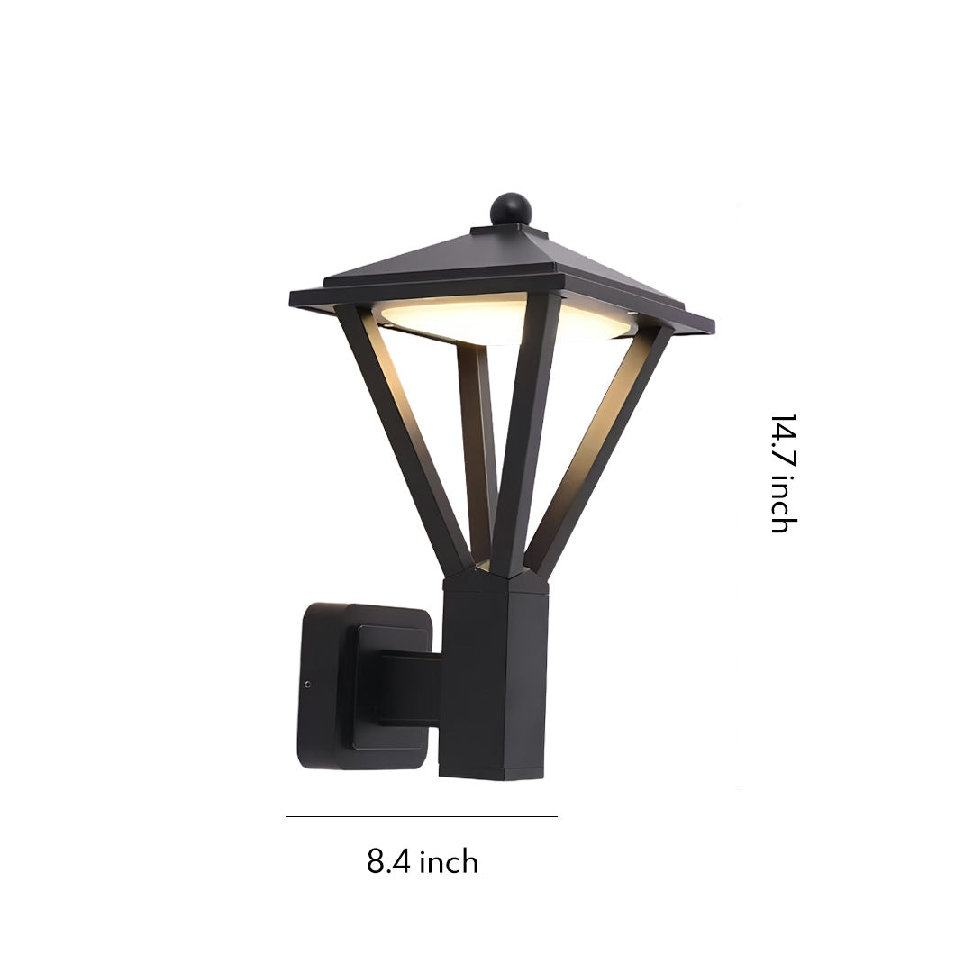 Black geometric lantern-style fixture mounted on an exterior wall, offering warm illumination and showcasing classic wall mounted lights outdoor.