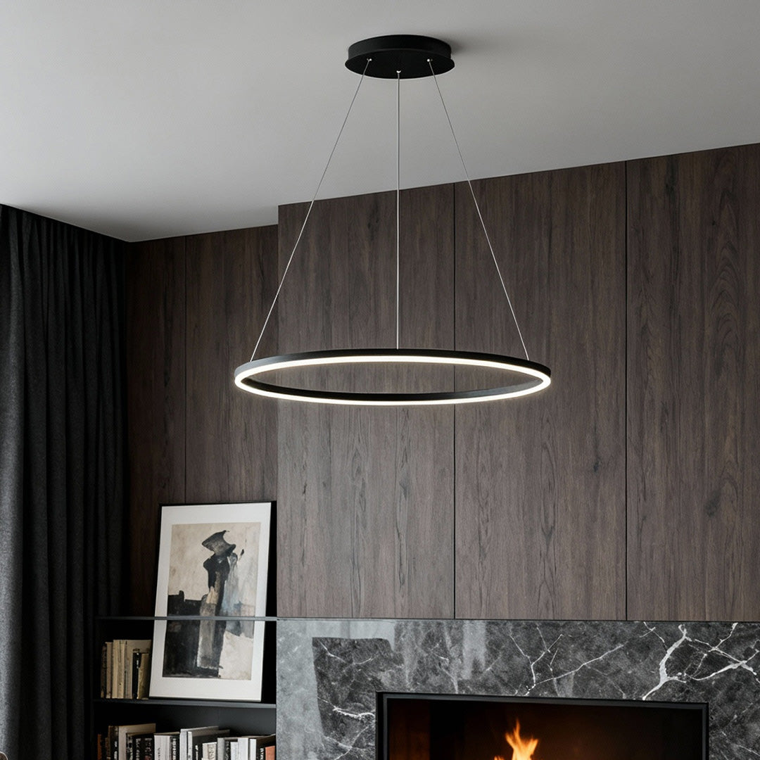 Modern black LED ring chandelier suspended above fireplace in contemporary living room.