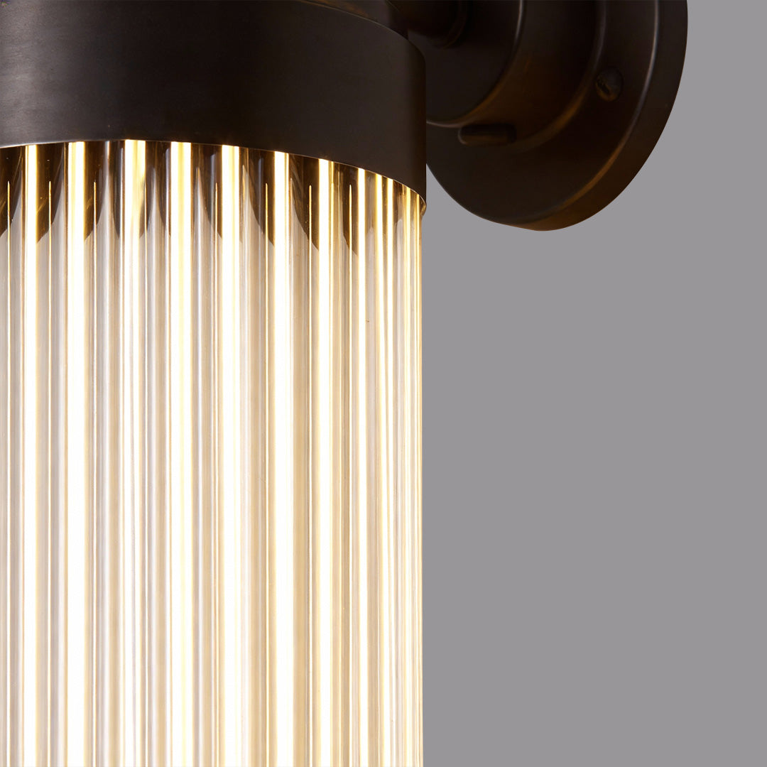 Modern black outdoor wall lighting LED fixture with vertical tubular bulbs, offering sleek and contemporary illumination.