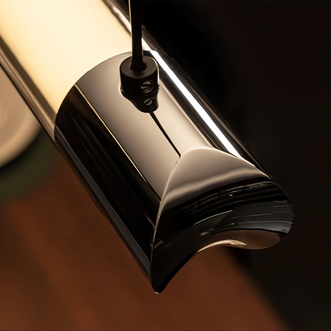 Close-up detail of black linear suspension light showing sleek metal housing and integrated LED technology