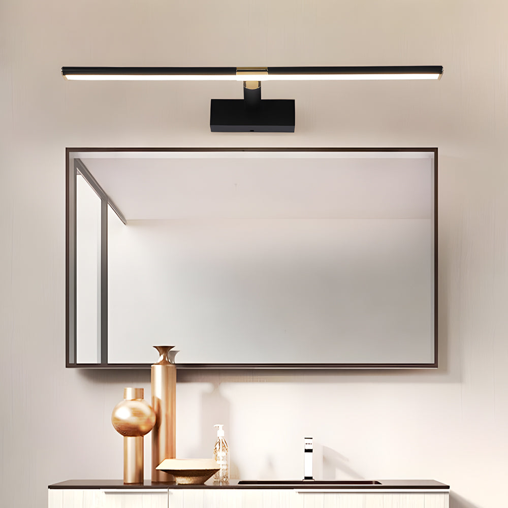 Black linear vanity light mounted above mirror in a master bathroom.